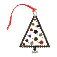 an ornament shaped like a christmas tree with many different colored stones on it