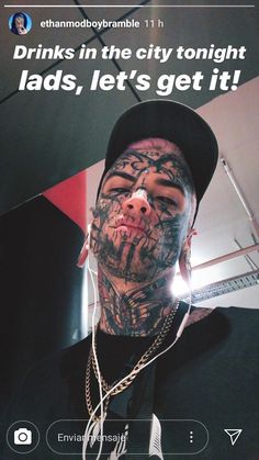 a man with tattoos and piercings on his face