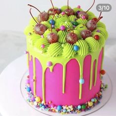 a birthday cake decorated with candy and sprinkles