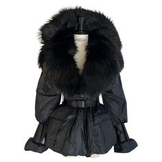 Tom Ford - Black nylon Puffer coat and fur trim with belt - Dramatic buckle detailing on the sleeves and waist - Real fur and real leather cuffs and belt - Fall 2011 collection - Italian size 38 Shopping Photography, Leather Trench Coat, Print Coat, Black Nylons, Leather Cuffs, Puffer Coat, Fur Trim, Leather Coat, Tom Ford