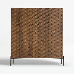 a wooden cabinet with an intricate design on the front and side panels, made out of wood