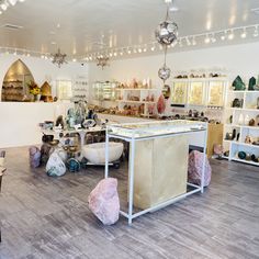 a room filled with lots of different colored vases