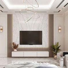 a modern living room with white furniture and a large flat screen tv mounted on the wall