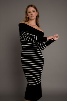 Make a stylish statement with our Off Shoulder Fold Striped Maxi Dress. This must-have dress features a knit and ribbed design, creating a flattering fit that accentuates your curves. The off shoulder neckline adds flair and the striped pattern adds a touch of sophistication. Perfect for any occasion, from a day out to a special event, this dress will have you turning heads. Off Shoulder Neckline, Striped Maxi, Striped Maxi Dresses