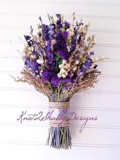 purple and white flowers in a vase on a wall with the words kodak media designs