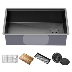 stainless steel kitchen sink with cutting board and accessories