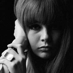 a black and white photo of a woman with long hair