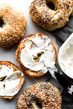 bagels with cream cheese spread on top