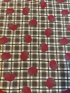 an apple pattern on a checkered table cloth