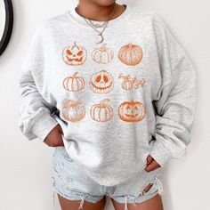 Halloween Crewneck Sweatshirt Halloween Shirts Spooky Shirt Spooky Season Hello Pumpkin Spooky Mom Shirt Halloween Shirt Pumpkin Shirt Ideal for any situation, a unisex heavy blend crewneck sweatshirt is pure comfort. These garments are made from polyester and cotton. This combination helps designs come out looking fresh and beautiful. The collar is ribbed knit, so it retains its shape even after washing. There are no itchy side seams on these sweaters. .: 50% Cotton 50% Polyester .: Medium-heav Halloween Crewneck Sweatshirt, Pumpkin Spooky, Hello Pumpkin, Cute Shirt Designs, Halloween Shirts, Pumpkin Shirt