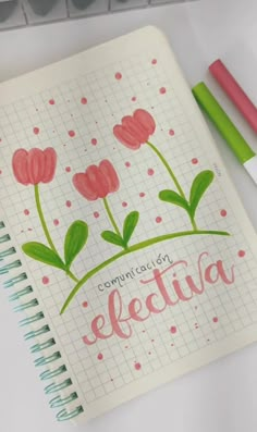 an open notebook with pink flowers and the words congratulations written in cursive writing