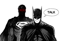 two batmans are standing next to each other and one has a red light on his face