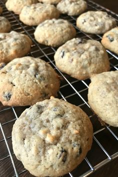 chocolate chip cookies cooling on a rack in the kitchen, ready to go into the oven