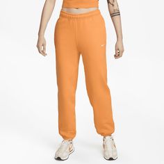 Premium fabric and a laid-back design highlight the Nike Solo Swoosh Pants. Part of the Essentials collection, these pants use a soft feel with a loose fit for all-day wear. Cheap Orange Nike Bottoms, Nike Relaxed Fit Sweatpants For Spring, Nike Sweatpants Relaxed Fit For Spring, Casual Orange Sports Pants, Nike Casual Pants With Straight Hem, Casual Nike Pants With Straight Hem, Casual Orange Sweatpants For Sports, Casual Orange Sweatpants With Elastic Waistband, Sporty Orange Sweatpants For Sports