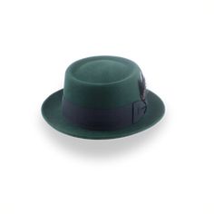 Description Materials Craftsmanship Hat Care Shipping Returns Product Description Custom Fit for Dark Green Porkpie Hat Transform your look with The Soloist, a dark green porkpie hat that blends sophisticated style with premium quality. Crafted from luxurious rabbit fur felt, this hat features a unique telescope crown for a smooth finish and lasting durability. The 3 5/8" crown height and 1 7/8" up-turned brim create a distinctive silhouette, while the 1 1/2" grosgrain ribbon hatband adds a touc Mens Felt Hats, Spanish Hat, Porkpie Hat, Homburg Hat, Outdoor Hut, Gambler Hat, The Raid, Mens Hats Fashion, Fedora Hat Men