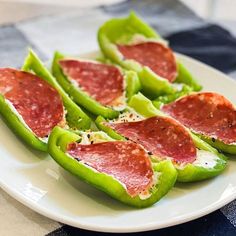 pepperoni and cheese stuffed peppers on a white plate