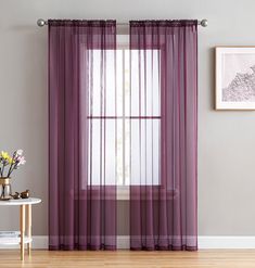 purple sheer curtains in front of a window