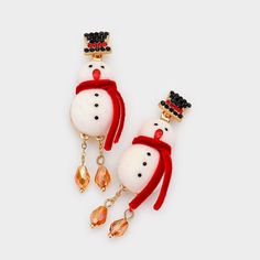 Add Some Sparkle And Joy To Your Winter Wardrobe With These Adorable Snowman Earrings. These Earrings Are Made Of Gold-Plated Metal And Feature A Cute Snowman Design With A Black Top Hat And Red Scarf. The Snowman’s Face Is Made Of Clear Crystals, While The Body Is Made Of White Enamel. The Earrings Are Also Accented With Dangling Teardrop-Shaped Crystals That Catch The Light Beautifully. These Earrings Are Perfect For Wearing To Holiday Parties, Family Gatherings, Or Any Festive Occasion. They White Jewelry For New Year Holiday, New Year Holiday White Jewelry, White Jewelry For Winter Holiday, White Winter Party Jewelry, White Earrings For Festive Holiday Season, White Jewelry For Holiday Party, White Holiday Party Jewelry, White Festive Earrings For Winter, Festive White Earrings For Winter