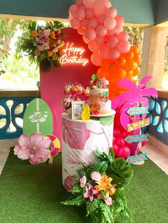 an outdoor birthday party with balloons and decorations