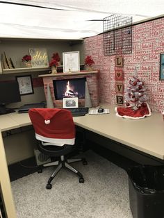 an office cubicle decorated for christmas with red and white decorations