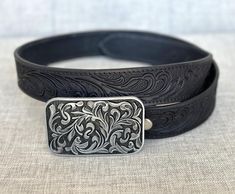 ABOUT:  ➤Stainless steel buckle with floral pattern ➤ 1-1/2" wide ➤100% handmade from one-piece full grain cowhide leather ➤Custom engraving option on the inside of belt ➤Belt thickness 3.2 mm - 1/8" thickness ➤ Easy snap system for interchanging buckles Personalized Belt that serves as a great gift for your loved one. You can choose to personalize this belt, making it an Engraved Belt. This is a handmade western leather belt with a stainless-steel cowboy buckle.  Tooled Western Floral Engraved Classic Adjustable Hand-tooled Belt, Classic Adjustable Hand Tooled Belt, Adjustable Western Belt Buckles For Everyday Use, Engraved Leather Belt Buckles, Adjustable, Engraved Leather Adjustable Belt Buckles, Adjustable Engraved Leather Belt Buckles, Adjustable Hand Tooled Belt Perfect For Gifts, Adjustable Hand Tooled Belt As Gift, Formal Adjustable Engraved Belt