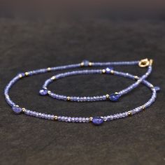 14k Solid Gold: Tanzanite Necklace, September Birthstone, Layered Necklace, Skinny Necklace, Delicate Beaded Gemstone, Fine Jewelry - Etsy Elegant Tanzanite Gemstone Bead Necklaces, Elegant Tanzanite Gemstone Bead Necklace, Elegant Tanzanite Beaded Necklace, Gold Tag, Tanzanite Necklace, Jewelry Showcases, Natural Tanzanite, September Birthstone, Layered Necklace