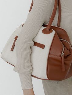 Editor's NotesCHRISTINE PROJECT's signature designed canvas bag can be matched with any casual outfits.- Sophisticated and casual mood- Mix-match of canvas and leather- Waterproof canvas fabric- Enough storage space- Daily point itemMeasurements(in.)One size (Unisex)- Body : 15.35 in. (W) * 9.84 in. (H) * 7.48 in. (D)- Handle : 7.48 in.- Weight : 1.54 lbComposition & Care- Vegan leather, Canvas- Natural leather may have fine scratches and wrinkles- Bright-toned leather can get colored by den Modern Brown Canvas Bag For On-the-go, Versatile Canvas Satchel For Errands, Chic Coated Canvas Bag For On-the-go, White Shoulder Bag With Leather Trim For On-the-go, Leather Canvas Bag With Large Capacity For On-the-go, Chic Canvas Bag For On-the-go, Modern Canvas Satchel, Versatile Beige Bags With Leather Trim, Chic Canvas Satchel With Removable Pouch