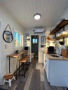 the kitchen is clean and ready to be used as a dining room or living area