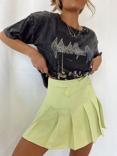 Brighten up your look with the Lane 201 It's Electric Pleated Skort! This trendy mini skater skort has paneled pleats, an asymmetrical button front, back zipper, and fully lined with shorts underneath.. In the most vibrant yellow -- you'll have no trouble standing out! Paired perfectly with the Rock Band Graphic Tee. SIZING - Runs true to size. - Morgan F. is 5'4" and is shown wearing a size small. SMALL: Waist 25" & Length 15" MEDIUM: Waist 27.5" & Length 16" LARGE: Waist 29" & Length 16" MATER Trendy Skort With Built-in Shorts For Day Out, Trendy Pleated Mini Shorts, Trendy Pleated Mini Length Shorts, Pleated Shorts For Night Out, Casual Pleated Shorts For Night Out, Trendy Pleated Short Tennis Skirt, Trendy Short Pleated Tennis Skirt, Edgy Short Mini Skirt For Summer, Edgy Mini Length Skort For Summer