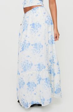 A charming floral pattern and flounce hem underscore the whimsical allure of an ankle-grazing maxi skirt topped with an adjustable drawstring waist for comfortable wear. 37" length (size 4) Drawstring waist Lined 100% polyester Machine wash, line dry Imported Floral Maxi Skirt, Modern Floral, Floral Maxi, White Skirts, Princess Polly, Skirt Top, Drawstring Waist, White Blue, Maxi Skirt