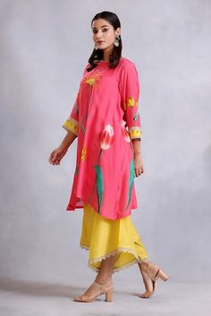 Pink kurta with floral pattern, highlighted with sequin and lace embroidery. Paired with a yellow draped pant. - Aza Fashions Floral Print Bottoms For Festive Spring Occasion, Floral Print Bottoms For Spring Festivities, Spring Floral Print Festive Bottoms, Spring Festive Floral Print Bottoms, Festive Spring Bottoms With Printed Motifs, Traditional Floral Print Bottoms For Spring, Traditional Spring Floral Print Bottoms, Yellow Drapes, Asymmetric Kurta