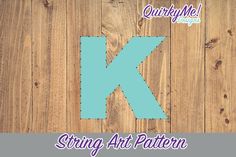 the letter k is made out of wood and has stitching on it to make an applique