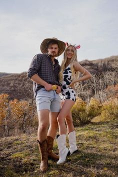 a man and woman in cowboy hats posing for a photo