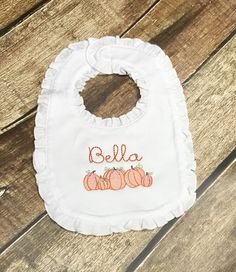 This beautiful personalized bib is perfect for your new baby or to give as a baby gift. This white bib is a beautiful, soft boutique qualtiy 100% cotton bib with ruffles that closes with velcro for easy on/off. The name will be as shown. Please include in the comment section when ordering the name you would like for the personalization. Please make certain that the name is spelled correctly; we cannot offer refunds due to personalization. Customizable White Bib For Babies, Personalized Cotton Bib As Gift, Cute White Bib Front Bib, Personalized White Bib For Birthday, Personalized White Birthday Bib, Customizable White Birthday Bib, Customizable White Cotton Bib, Cute Machine Washable Bib As Gift, White Machine Washable Bib For Gift