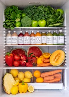 an open refrigerator filled with fruits and vegetables