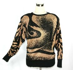 Gorgeous vintage 1980's sweater from TJW of Mervyn's featuring an artistic swirl and tiger stripes pattern in metallic gold and black.  ~Light shoulder padding ~Ribbed cuffs, hem, and neckline There is no "ingredients" tag so I am only guessing that it's made of acrylic due to the feel and the vintage of the knit. There is also no size tag. It fits closest to a smallish-medium. Please see measurements below.  This sweater is in excellent vintage condition and is ready for you to rock it!   Measu Tiger Stripes Pattern, Wave Sweater, Stripes Sweater, Bad Reputation, Tiger Stripes, Pullover Sweater Women, Black Abstract, New Wave, Women Pullover