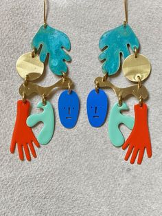 Fernanda Sibilia is an Argentinian designer working out of Buenos Aries. Her lively designs, handcrafted in brass and finished with vibrant enamel and remarkable patinas, add joy to daily living. "El Magico" chandelier earrings, at 4 inches long, make quite a statement. (Hooks are made of surgical steel.) Designer Working, Human Touch, Wide Cuff Bracelets, Festival Diy, Resin Design, Daily Living, Earrings Inspiration, Acrylic Earrings, Steel Jewelry