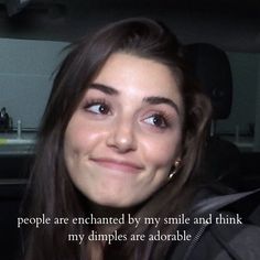 a woman smiling and looking at the camera with a quote above her that reads people are enchanted by my smile and think my dimples are adorable