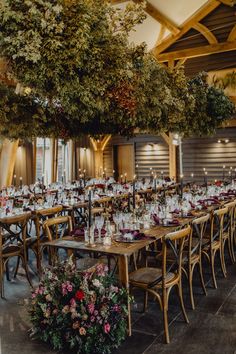 the tables are set up with candles and centerpieces for an elegant wedding reception