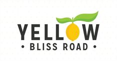 the yellow bliss road logo is shown in black and white, with a green leaf on top