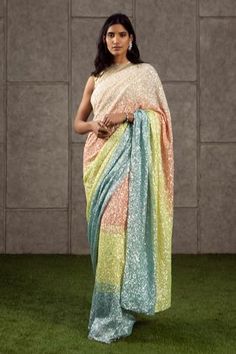 Multicolored saree with all over sequin work. Comes with striped blouse.
Components: 2
Fabric: Georgette, Net, Lame
Neckline: Round
Sleeve Length: Sleeveless
Color: Multi Color
Embellished
Sequin work - Aza Fashions Embellished Saree, Kalamkari Saree, Embroidered Saree, Blouse For Women, Indian Fashion Designers, Blouse Online, Saree With Blouse, Designer Gowns, Indian Design