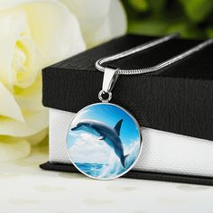 🌘MESSAGE CARD🌒 Dolphins, The Eternal Companions of the Sea, the interconnectedness of all life in the vast expanse of the ocean. 🌘JEWELLERY DESCRIPTION🌒 Dive into the enchanting world beneath the waves with our mesmerizing Dolphin Necklace collection, a celebration of the ocean's playful spirits and the beauty of marine life. Each pendant is a testament to the timeless fascination we have with these graceful creatures, meticulously designed to bring the magic of the ocean to your style. Disc Personalized Ocean-inspired Jewelry Gift, Ocean-inspired Jewelry With Round Pendant For Gift, Ocean-inspired Round Pendant Jewelry For Gift, Ocean-inspired Round Pendant Jewelry Gift, Ocean-inspired Jewelry As Gift, Ocean-inspired Jewelry As A Gift, Ocean Color Pendant Necklace As Gift, Dolphin Jewelry, Dolphin Necklace