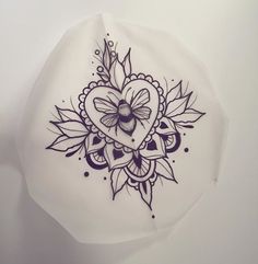 a white plate with a black and purple design on it's side, in the shape of a heart