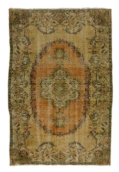 an antique rug with orange and green colors on the bottom, surrounded by ornate designs