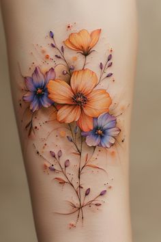 a woman's thigh with flowers painted on it