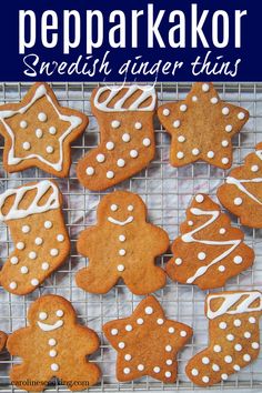 several ginger cookies on a cooling rack with white icing and sprinkles