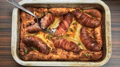 a casserole dish with meat wrapped in cheese