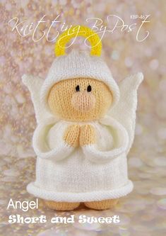 a knitted angel doll sitting on top of a white surface with the words knitting by post written below it