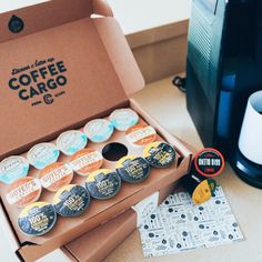 a coffee box with several different types of buttons in it