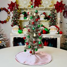 a small christmas tree sitting on top of a table